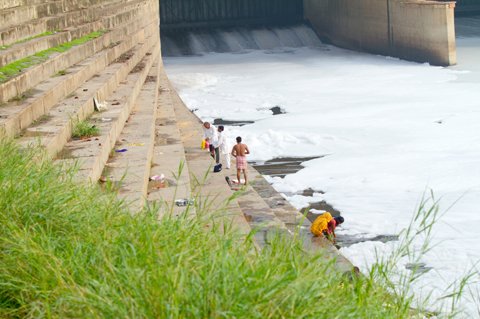 , ISTOCKPHOTO

New Delhi, India - July 14, 2012. Indian Hindu devotees bathe in the polluted waters of the Yamuna river. UN-Habitat estimates the city of Delhi dumps 3 billion litres of waste into the Yamuna each day, and says it is dead, without enough oxygen to support river life.